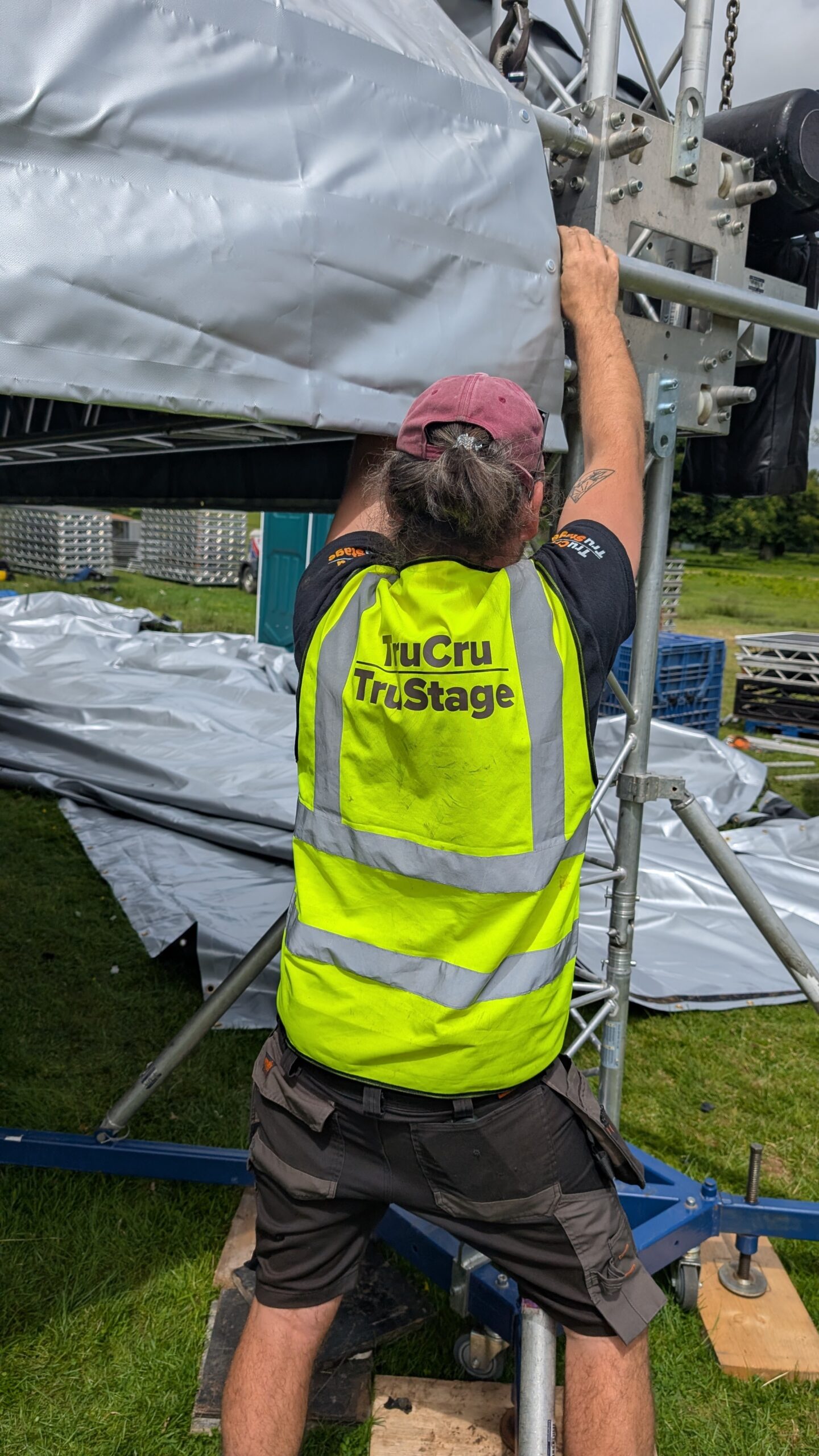 TruCru employee working on the Milos MR2K roof TruCru provided for Tunes in the Castle and Powderham Castle